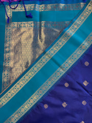 Semi kanjivaram soft silk Saree in Dark blue with light blue border.Fall peco done. Comess with stitched blouse size 38 can be altered up to 44 size.
