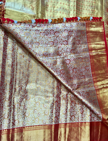 KSS510 Pure kanchipuram tissue silk Saree in orange with gold zari work.comes with stitched blouse size 40,can be altered to 44 size.