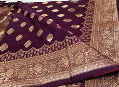 BKS127 Banarasi Mashru silk Saree in brown. Comes with gold zari work. Comes with stitched blouse size 38 can be altered to size 42. Fall peco done.