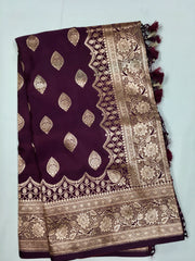 BKS127 Banarasi Mashru silk Saree in brown. Comes with gold zari work. Comes with stitched blouse size 38 can be altered to size 42. Fall peco done.
