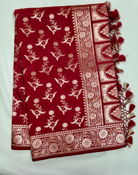 BKS121 Banarasi Mashru silk Saree in maroon. comes with gold zari work. Comes with stitched blouse size 38 can be altered to size 42. Fall peco done.