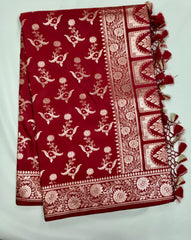 BKS121 Banarasi Mashru silk Saree in maroon. comes with gold zari work. Comes with stitched blouse size 38 can be altered to size 42. Fall peco done.