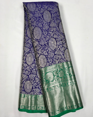 KSS507 Pure kanchipuram handloom silk Saree in purple with green color gold zari border. comes with stitched blouse size 40,can be altered to 44 size.