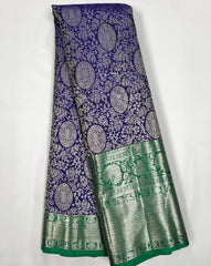 KSS507 Pure kanchipuram handloom silk Saree in purple with green color gold zari border. comes with stitched blouse size 40,can be altered to 44 size.