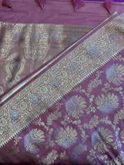 Banarasi Tussari georgette saree in Onion Pink with gold and silver zari border. Fall peco done. Comes with stitched blouse size 38 can be altered up to 44 size.