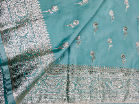 BKS118 Banarasi Mashru silk Saree in light blue. Comes with silver zari work. Comes with stitched blouse size 38 can be altered to size 42. Fall peco done.
