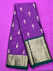 KSS411 Pure kanchipuram silk Saree in purple and green gold zari border.comes with stitched blouse size 40,can be altered to size 44.Fall peco done.