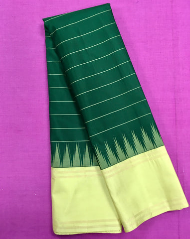 KSS425 Pure handloom kanchipuram silk Saree in bottle green with gold zari border.comes with stitched blouse size 40,can be altered to 44 size.