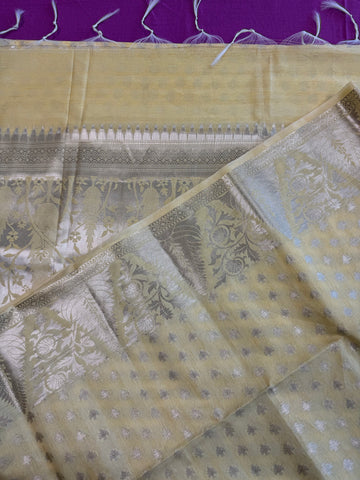 Semi Raw mango Saree in yellow with Silver  Zari Border.Fall peco done. Comess with stitched blouse size 38 can be altered up to 44
