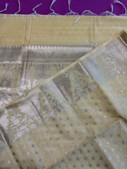 Semi Raw mango Saree in yellow with Silver  Zari Border.Fall peco done. Comess with stitched blouse size 38 can be altered up to 44