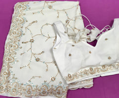 AFL3056 Partywear saree in white with  sequins and bead work.Comes with stitched blouse size 38,can be altered to 42size.Fall peco done.