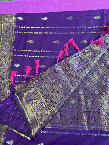 Banarasi silk  saree in purple  with Gold Zari border.Fall peco done. Comess with stitched blouse size 38 can be altered up to 44 size.