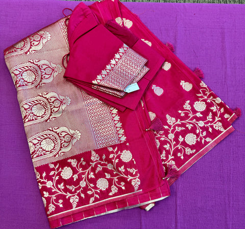 semi silk banarasi Saree in Rani Pink  with Gold  Zari Border.Fall peco done. Comess with stitched blouse size 38 can be altered up to 44