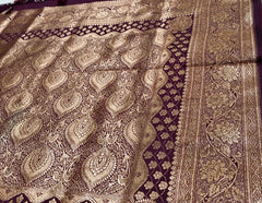 BKS127 Banarasi Mashru silk Saree in brown. Comes with gold zari work. Comes with stitched blouse size 38 can be altered to size 42. Fall peco done.
