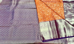 KSS415 Pure kanchipuram tissue silk Saree in orange with purple border gold zari work.comes with stitched blouse size 40,can be altered to 44 size.
