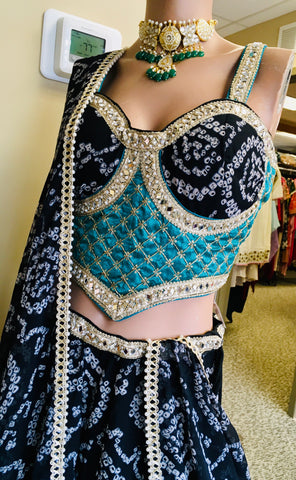 AFL9006 Bandhani printed lehenga in black. Comes with  stitched blouse and dupatta.