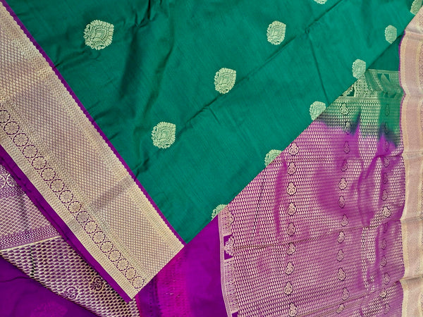 KSS340 Kanjivaram Semi Silk Saree In Dark Green w/ Magenta Border. Fall Peco done. Comes w/ stitched blouse size: 38 to 46.