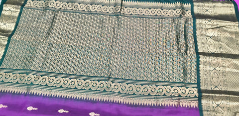KSS411 Pure kanchipuram silk Saree in purple and green gold zari border.comes with stitched blouse size 40,can be altered to size 44.Fall peco done.