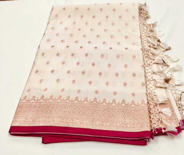BKS131 Banarasi Mashru silk Saree in white.Comes with gold zari work. Comes with stitched blouse size 38 can be altered to size 42. Fall peco done.