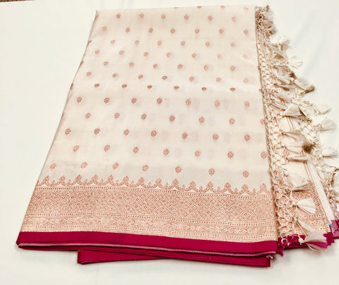 BKS131 Banarasi Mashru silk Saree in white.Comes with gold zari work. Comes with stitched blouse size 38 can be altered to size 42. Fall peco done.