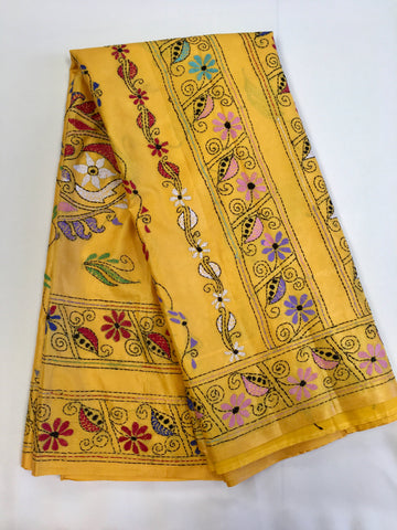 KSN203 - Semi Silk Kantha Tusser Saree in yellow hand work design. Fall Peco done. Comes with stitched Blouse size 38 it can be altered to 44 size.