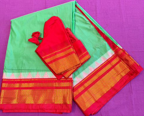 Korvai silk cotton saree in Green with orange border.Fall peco done. Comes with stitched blouse size 38 can be altered up to 44 size.
