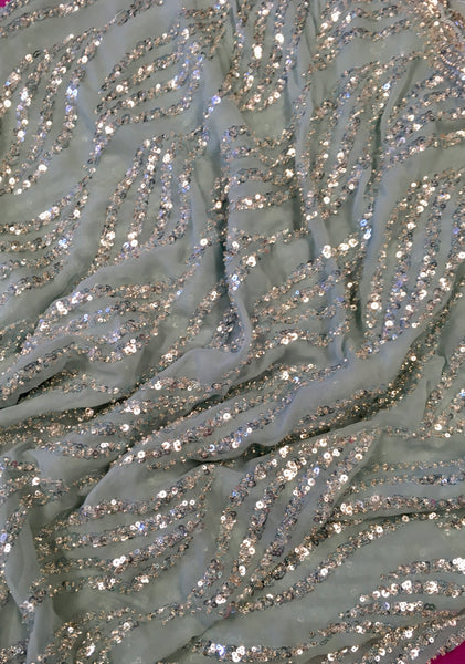 AFL3073 Party wear saree with sequin and bead work in light blue. Comes with stitched blouse size 38,can be altered to 42 size.Fall peco done.