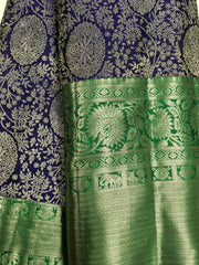 KSS507 Pure kanchipuram handloom silk Saree in purple with green color gold zari border. comes with stitched blouse size 40,can be altered to 44 size.