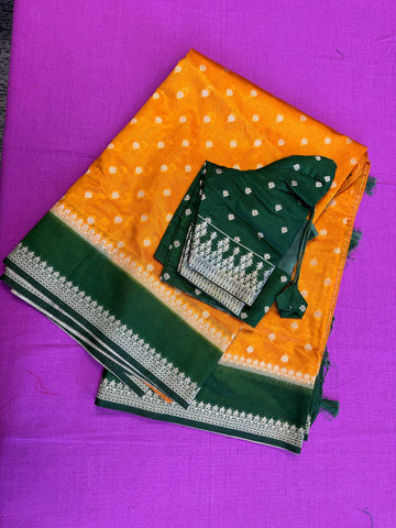 Banarasi Munga silk  saree in yellow  with Bottle Green border. Fall peco done. Comes with stitched blouse size 38 can be altered up to 44 size.