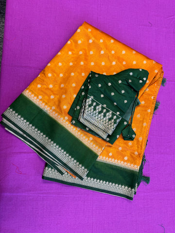 Banarasi Munga silk  saree in yellow  with Bottle Green border.Fall peco done. Comess with stitched blouse size 38 can be altered up to 44 size.