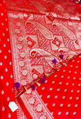 BKS116 Banarasi Mashru silk Saree in red.Comes with gold zari work. Comes with stitched blouse size 38 can be altered to size 42. Fall peco done.