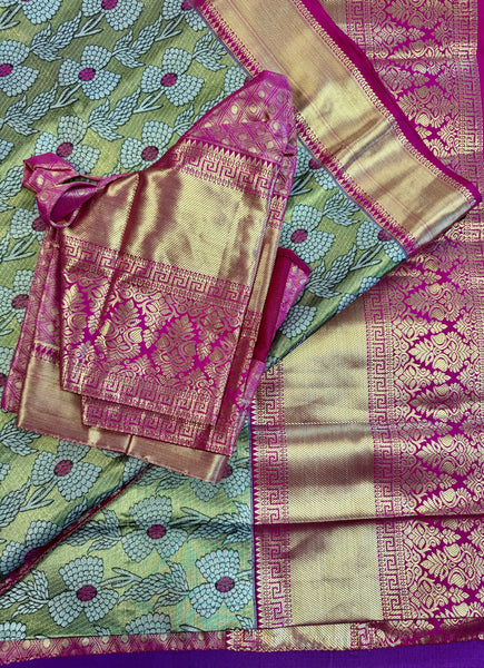 Semi Silk Saree in green with pink Gold zari border. Comes with stitched blouse size 38 can be altered up to 44