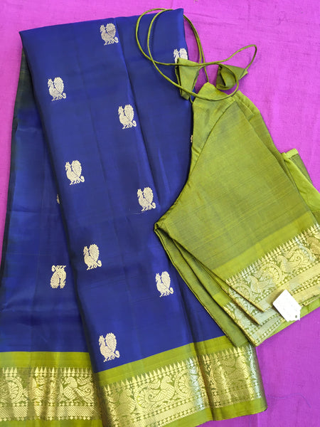 Pure kanchipuram Handloom Silk Saree in navy blue with Green Border. Comess with Stitched Blouse size 38 can be altered up to 44 size.