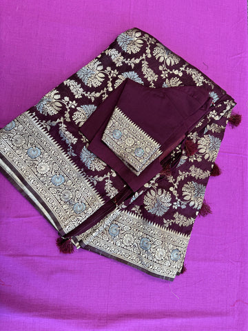 Banarasi Tussari georgette saree in Brown with gold and silver zari border.Fall peco done. Comess with stitched blouse size 38 can be altered up to 44 size.