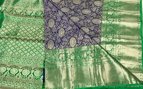 KSS507 Pure kanchipuram handloom silk Saree in purple with green color gold zari border. comes with stitched blouse size 40,can be altered to 44 size.