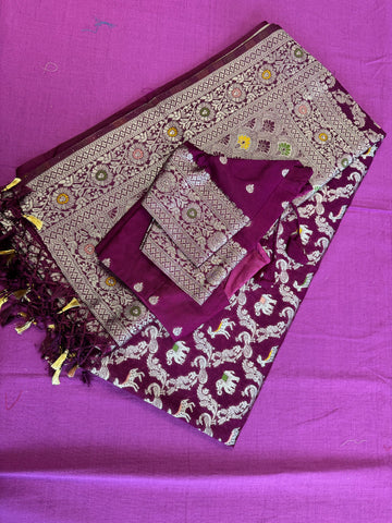 semi silk banarasi Saree in wine with Zari Border. Comess with stitched blouse size 38 can be altered up to 44