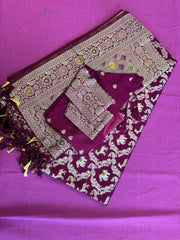 semi silk banarasi Saree in wine with Zari Border. Comess with stitched blouse size 38 can be altered up to 44