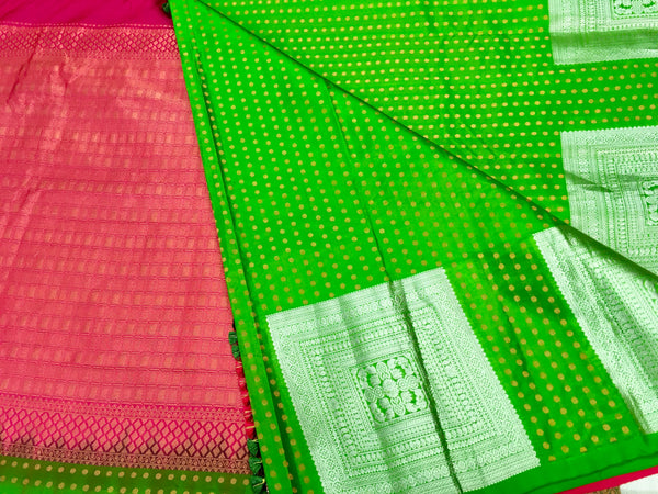 KSS402 Pure handloom kanchipuram silk Saree in green with gold and silver zari border.comes with stitched blouse size 40,can be altered to 44 size.