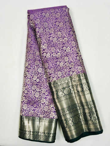 KSS506 - Pure kanchipuram tissue silk Saree in purple color with bottle green color gold zari border. comes with stitched blouse size 40,can be altered to 44 size.