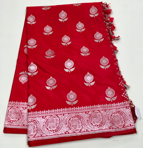BKS128 Banarasi Mashru silk Saree in red. Comes with silver zari work. Comes with stitched blouse size 38 can be altered to size 42. Fall peco done.