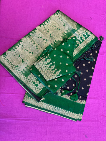 Banarasi Munga silk  saree in black  with Green border.Fall peco done. Comess with stitched blouse size 38 can be altered up to 44 size.