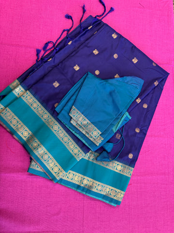Semi kanjivaram soft silk Saree in Dark blue with light blue border.Fall peco done. Comess with stitched blouse size 38 can be altered up to 44 size.