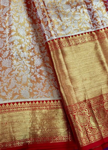 KSS448 Pure kanchipuram tissue silk Saree in orange with gold zari border.comes with stitched blouse size 40,can be altered to 44 size.