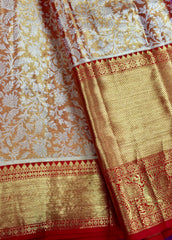 KSS448 Pure kanchipuram tissue silk Saree in orange with gold zari border.comes with stitched blouse size 40,can be altered to 44 size.