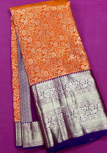 KSS415 Pure kanchipuram tissue silk Saree in orange with purple border gold zari work.comes with stitched blouse size 40,can be altered to 44 size.