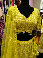 AFL4002 Wedding lehenga in yellow comes with heavy embroidery and sequin work.comes with net dupatta and stitched blouse.