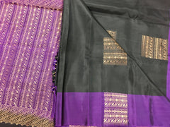 KSS438 kanchipuram silk Saree in black with purple gold zari border.comes with stitched blouse size 40,can be altered to 44 size.