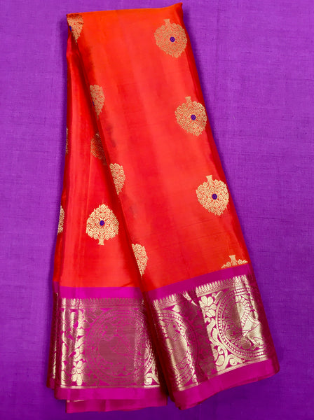KSS433 Pure handloom kanchipuram silk Saree in orange with pink gold zari border.comes with stitched blouse size 40,can be altered to 44 size.