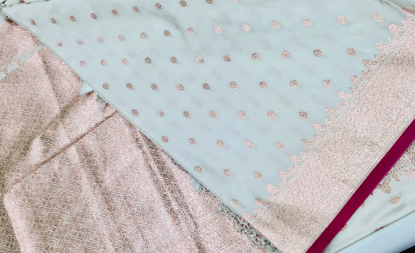 BKS131 Banarasi Mashru silk Saree in white.Comes with gold zari work. Comes with stitched blouse size 38 can be altered to size 42. Fall peco done.