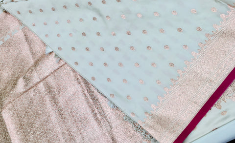 BKS131 Banarasi Mashru silk Saree in white.Comes with gold zari work. Comes with stitched blouse size 38 can be altered to size 42. Fall peco done.